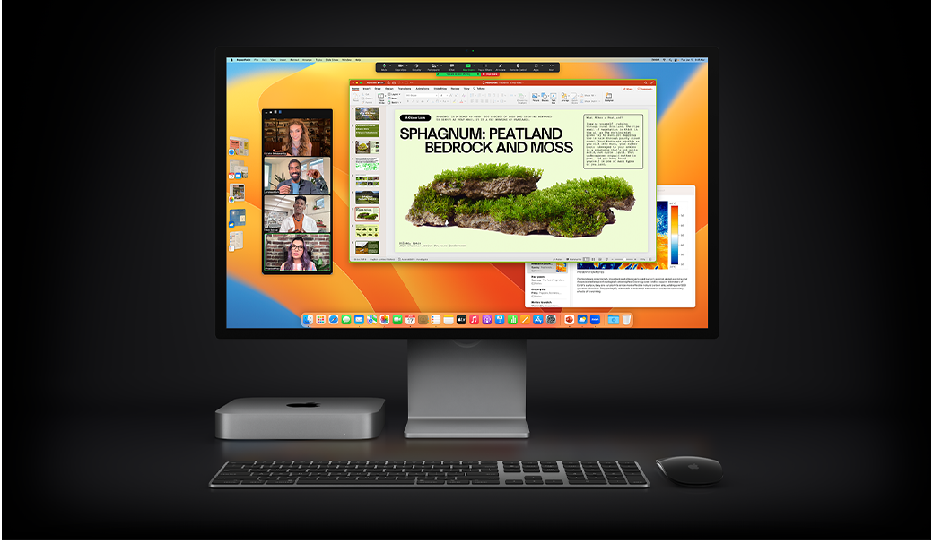 Un Mac mini con un Magic Mouse, un Magic Keyboard y un Studio Display con una presentación de Microsoft PowerPoint abierta durante una llamada de Zoom, y la app Notas en segundo plano.