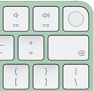 Magic Keyboard, esquina superior derecha, color verde, Touch ID, tecla Suprimir y teclas de función de volumen