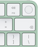 Magic Keyboard, esquina superior derecha, color verde, Touch ID, tecla Suprimir y teclas de función de volumen